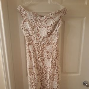 Form fitting white lace dress